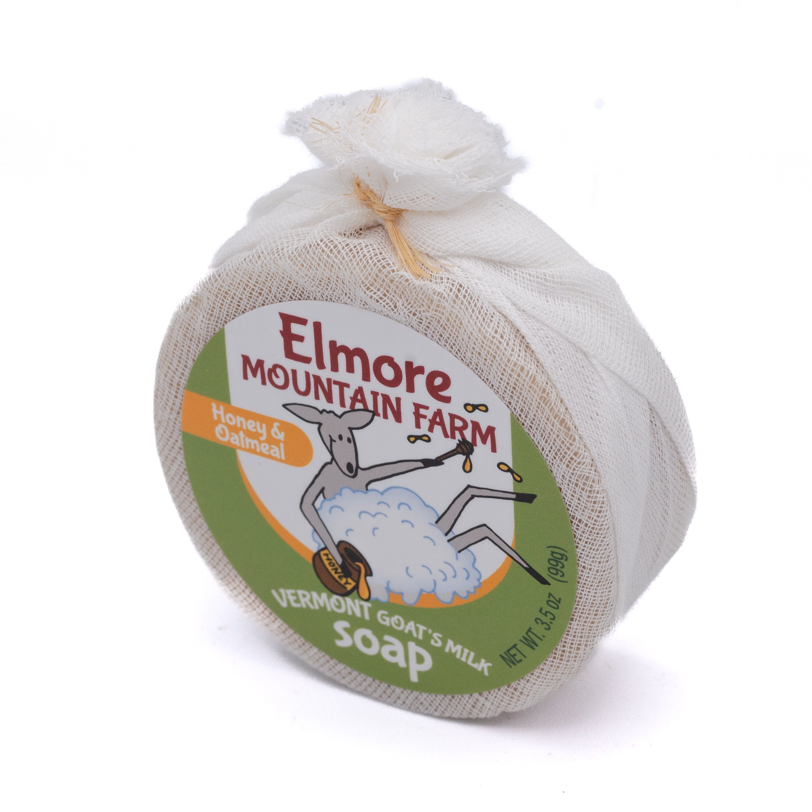round bar of elmore mountain farm honey oatmeal goat milk soap wrapped in cheesecloth